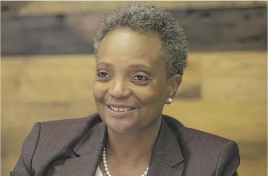  ?? ASHLEE REZIN GARCIA/SUN-TIMES FILE ?? A poll conducted in late May shows a 75% job approval rating and a 77% favorabili­ty rating for Mayor Lori Lightfoot.