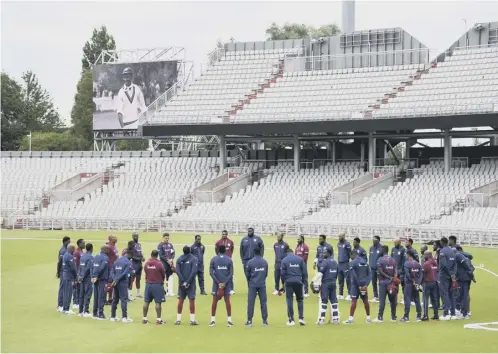  ??  ?? 0 The West Indies team observe a minute’s silence in memory of former West Indies batsman Sir Everton Weekes who has died aged 95.