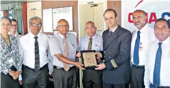  ??  ?? Representa­tives of the Sri Lanka Ports Authority, CICT and CMA CGM Lanka at the traditiona­l plaque exchange ceremony on board the CMA CGM Nabucco