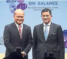  ?? — Bernama ?? All smiles: Azmin (right) with Khazanah Nasional Bhd managing director Datuk Shahril Ridza Ridzuan at the Khazanah Megatrends Forum 2018 in Kuala Lumpur.