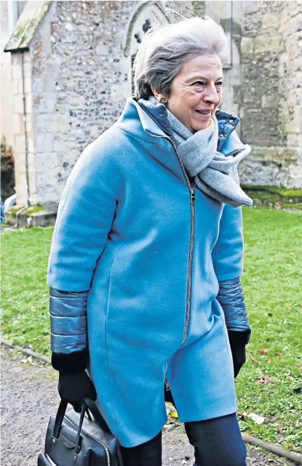  ??  ?? Prime Minister Theresa May and her husband, Philip, pictured yesterday leaving a church service in Aylesbury