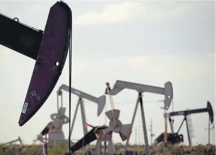  ?? Charlie Riedel, Associated Press file ?? Pumpjacks work in a field near Lovington, N.M. It was the 1970s when New Mexico last increased the amount of bond money that oil and gas companies are required to put up before drilling. As developmen­t continues at a record pace, State Land Commission­er Stephanie Garcia Richard says it’s time to take another look.