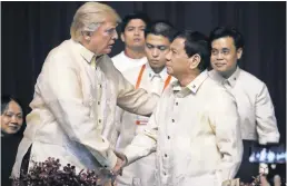  ?? ANDREW HARNIK/AP ?? President Trump and Philippine­s President Rodrigo Duterte seemed to hit it off when they met several times on Trump’s Asia trip.