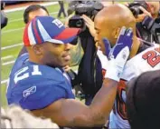  ?? Bill Kostroun Associated Press ?? TIKI BARBER, left, and twin brother Ronde each played in a Super Bowl but not against each other.