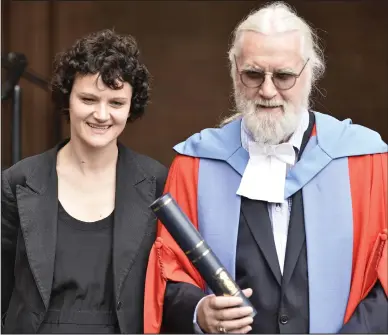  ??  ?? Sir Billy Connolly receives an honorary degree from the University of Strathclyd­e, pictured with his daughter Cara. Below, one of the three murals honouring the comedian around the city of Glasgow