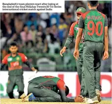  ??  ?? Bangladesh’s team players react after losing at the end of the final Nidahas Twenty20 Tri-series internatio­nal cricket match against India