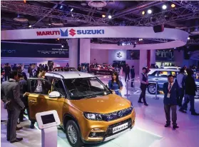  ?? Bloomberg ?? Maruti Suzuki’s Vitara Brezza has made a dent in Mahindra’s dominance of the domestic market to become the fourth best-selling car