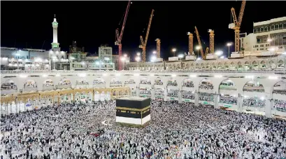  ??  ?? Muslim worshipper­s circle around the Kaaba, Islam's holiest shrine, at the Grand Mosque in Saudi Arabia's holy city of Mecca. AFP/Ahmad al-Rubaye