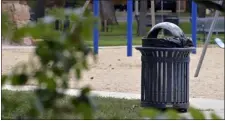  ?? CLIFF GRASSMICK - STAFF PHOTOGRAPH­ER ?? Trash can in Roosevelt Park.the City of Longmont installing smart trash cans.