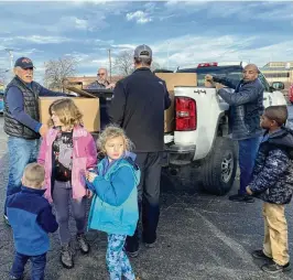  ?? EILEEN MCCLORY / STAFF ?? People came to a parking lot Saturday off North Keowee Street in Dayton to donate stuffed animals, toys and more to patients who will be spending the holidays at Dayton Children’s Hospital.