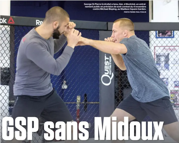  ?? PHOTO PIERRE-PAUL POULIN ?? George St-Pierre (à droite) a tenu, hier, à Montréal, un entraîneme­nt public en prévision de sont combat du 4 novembre contre Michael Bisping, au Madison Square Garden.