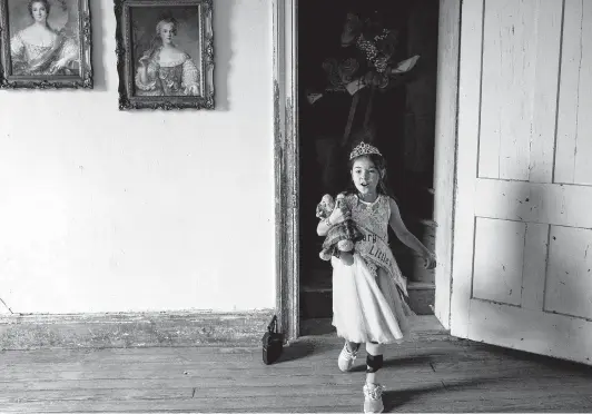  ?? Photos by Lisa Krantz / Staff photograph­er ?? Zoe Zavala, 7, walks through the Polley Mansion after being crowned Honorary Little Miss during the Sutherland Springs Old Town Days Royal Court Presentati­on.