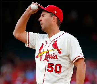  ?? Dilip Vishwanat/Getty Images ?? Cardinals starting pitcher Adam Wainwright reacts to giving up a home run to Adam Frazier on the first pitch of the Game Saturday night in St. Louis.