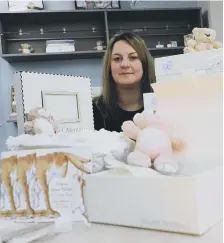  ??  ?? Kirsty McGurrell with the memory boxes.