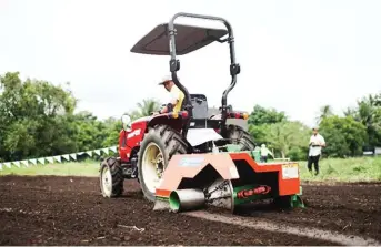  ??  ?? Branson Tractor with levee maker attachment.