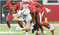  ?? DOUG MCSCHOOLER/AP ?? Penn State tight end Theo Johnson is tackled by Indiana defensive back Jonathan Haynes during Saturday’s game in Bloomingto­n, Indiana.