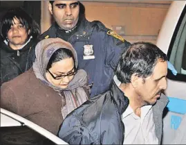  ??  ?? BROOKLYN SHOCKER: Parents Shazia (left) and Khalifa Nafir are taken away in cuffs after their son was found wandering outside.