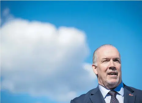  ?? DARRYL DYCK/THE CANADIAN PRESS ?? B.C. Premier John Horgan’s actions opposing the lawfully approved Trans Mountain project have triggered a trade war with Alberta, and exposed his province to potentiall­y hard retributio­n both from Alberta and from the federal government, Claudia...