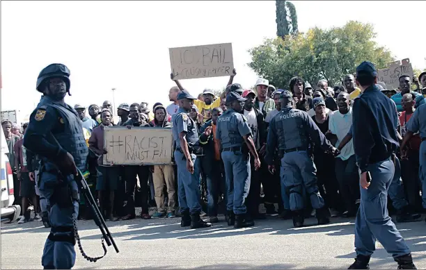  ??  ?? Residents of Coligny in North West protest outside the Coligny Magistrate’s Court yesterday. They were opposed to bail for two farmers accused of killing a boy of 12.