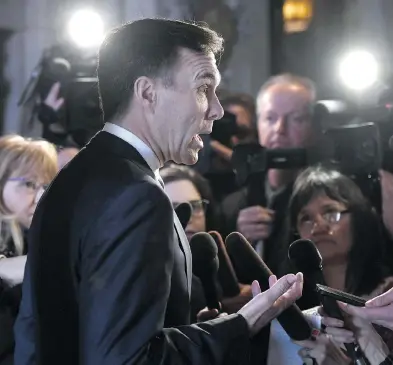  ?? JUSTIN TANG / THE CANADIAN PRESS ?? Finance Minister Bill Morneau speaks to reporters earlier this month. One of the predominan­t themes of next week’s federal budget will be increasing the work-force participat­ion of women, John Ivison writes.