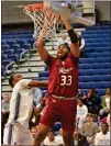  ?? KYLE FRANKO — TRENTONIAN PHOTO ?? Rider’s Tariq Ingraham, right, tries to dunk the ball as he’s fouled by Saint Peter’s Stephon Roberts, left, during a game on Thursday night at Run Baby Run Arena in Jersey City.