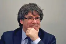  ?? - Reuters/Eric Vidal/File ?? IN SELF IMPOSED EXILE: Former Catalan leader Carles Puigdemont takes part in a meeting with his party in Brussels, Belgium March 14, 2018.