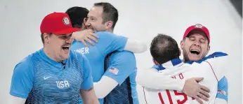  ??  ?? The United States team celebrates after its 10-7 win against Sweden during the gold-medal match on Saturday at the Gangneung Curling Centre.