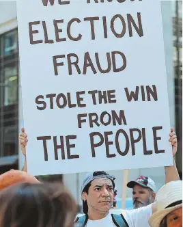  ?? STAFF PHOTO, ABOVE, BY NANCY LANE; AP PHOTO, BELOW ?? RALLIES: Above, supporters of Bernie Sanders protest outside of city hall in Philadelph­ia yesterday, while other demonstrat­ors make their way around the city’s downtown area, below.