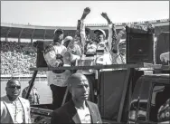  ?? AFP ?? Zimbabwe’s President Emmerson Mnangagwa (center) arrives
for his presidenti­al campaign rally in Harare, on Saturday.