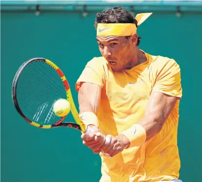  ??  ?? Rafael Nadal returns the ball to Grigor Dimitrov during their semi-final match.