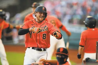  ?? Santiago Mejia / The Chronicle ?? Giants right fielder Hunter Pence celebrates his threerun home run in the third inning, his second such homer in eight atbats, but the A’s would come back to win late.