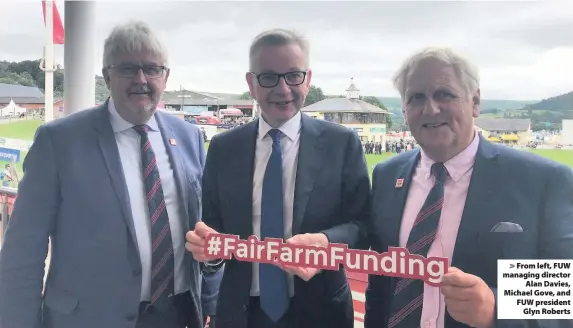  ??  ?? > From left, FUW managing director Alan Davies, Michael Gove, and FUW president Glyn Roberts