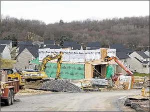  ?? AP file photo ?? Work continues at a housing developmen­t in Zelienople, Pa. Despite January’s jump in home constructi­on, builders haven’t been moving fast enough to meet demand.