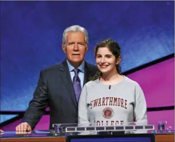  ?? SUBMITTED PHOTO ?? Swarthmore College student Rebecca Rosenthal is pictured with ‘Jeopardy!’ host Alex Trebek recently on the set of the show in Culver City, Calif. She was a contestant in the ‘Jeopardy! College Championsh­ip’ tournament, which will air April 9-20 at 7...