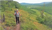  ??  ?? Carol Lewis hikes along the Escarpment Trail in the Porcupine Mountains.