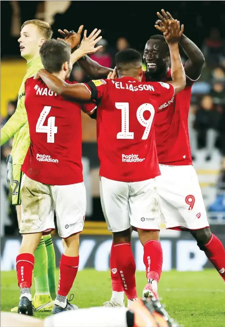  ?? PICTURES: PA Images ?? DELIGHT: Bristol City’s Famara Diedhiou celebrates scoring the winner with his team-mates