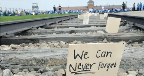  ?? JANEK SKARZYNSKI / AFP / GETTY IMAGES ?? A sign is seen on the tracks at the former Nazi German Auschwitz-Birkenau death camp in Oswiecim, Poland.