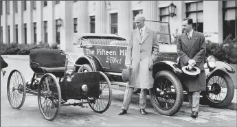  ?? FORD MOTOR CO./TNS ?? Henry Ford and Edsel Ford circa 1927 with the company's 15 millionth car.