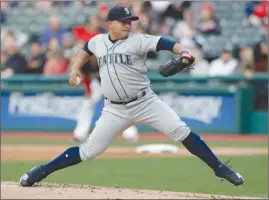  ?? The Associated Press ?? Seattle Mariners starting pitcher Erasmo Ramirez winds up during the first inning against the Cleveland Indians on Friday in Cleveland.The Mariners lost 6-5.