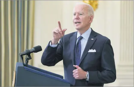  ?? EVAN VUCCI — THE ASSOCIATED PRESS ?? President Joe Biden takes questions from reporters as he speaks about the COVID-19vaccinat­ion program, in the State Dining Room of the White House, May 4, in Washington.