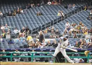  ?? Gene J. Puskar / Associated Press ?? Fans watch as Milwaukee Brewers’ Eric Thames swings at a third strike from Pittsburgh Pirates starting pitcher Joe Musgrove on Monday in Pittsburgh. The official culprit last season was the weather, which Major League Baseball cited as a big reason for a 4 percent slide in attendance over the previous year. This season? Well, attendance is down once again — only this time there are new excuses being offered for the drop.