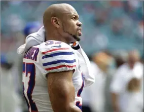  ?? LYNNE SLADKY - THE ASSOCIATED PRESS ?? FILE - In this Dec. 2, 2018, file photo Buffalo Bills outside linebacker Lorenzo Alexander (57) looks up from the sidelines, during the first half of an NFL football game against the Miami Dolphins in Miami Gardens, Fla. Vowing to retire after this season, the 13-year NFL veteran knows Sunday’s regular-season finale against the New York Jets won’t be his final game for the playoff-bound Bills.