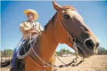  ??  ?? Rick Iannucci, executive director for Horses For Heroes, rides Hollywood, a quarter horse, during a training session for new instructor­s for the veterans’ program.