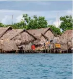  ??  ?? Girl power
The Guna Yala place women at the centre of society: they are the primary breadwinne­rs and property owners – that property usually comprising bamboo-thatched huts (pictured above)