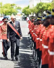  ?? TAYLOR/PHOTOGRAPH­ER GLADSTONE ?? Governor General Sir Patrick Allen inspects the guard of honour at the official opening of Parliament at Gordon House, yesterday.