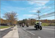  ??  ?? Motorcycli­sts ride in the Brunswick Harley Owners Group’s 19th annual Toys for Tots Benefit Ride on Sunday in Brunswick.