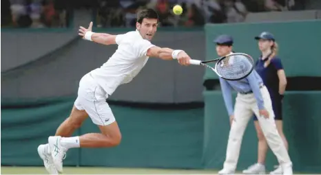 ??  ?? Serbia’s Novak Djokovic plays a shot at Wimbledon Championsh­ips. — Reuters