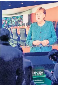  ?? FOTO: DPA / MICHAEL KAPPELER ?? Einsame Ruferin: Bundeskanz­lerin Merkel sprach coronoabed­ingt nur per Videobotsc­haft mit den deutschen Wirtschaft­sbossen.