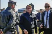  ?? ANDRE PENNER — THE ASSOCIATED PRESS ?? Brazilian President Jair Bolsonaro arrives Friday at a resort hotel where he later met with Elon Musk.