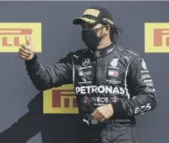  ??  ?? 0 Lewis Hamilton celebrates his British GP triumph.